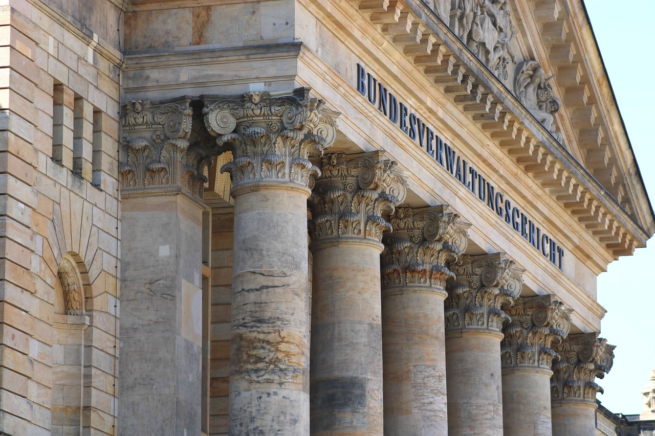the outside of a courthouse with pillars