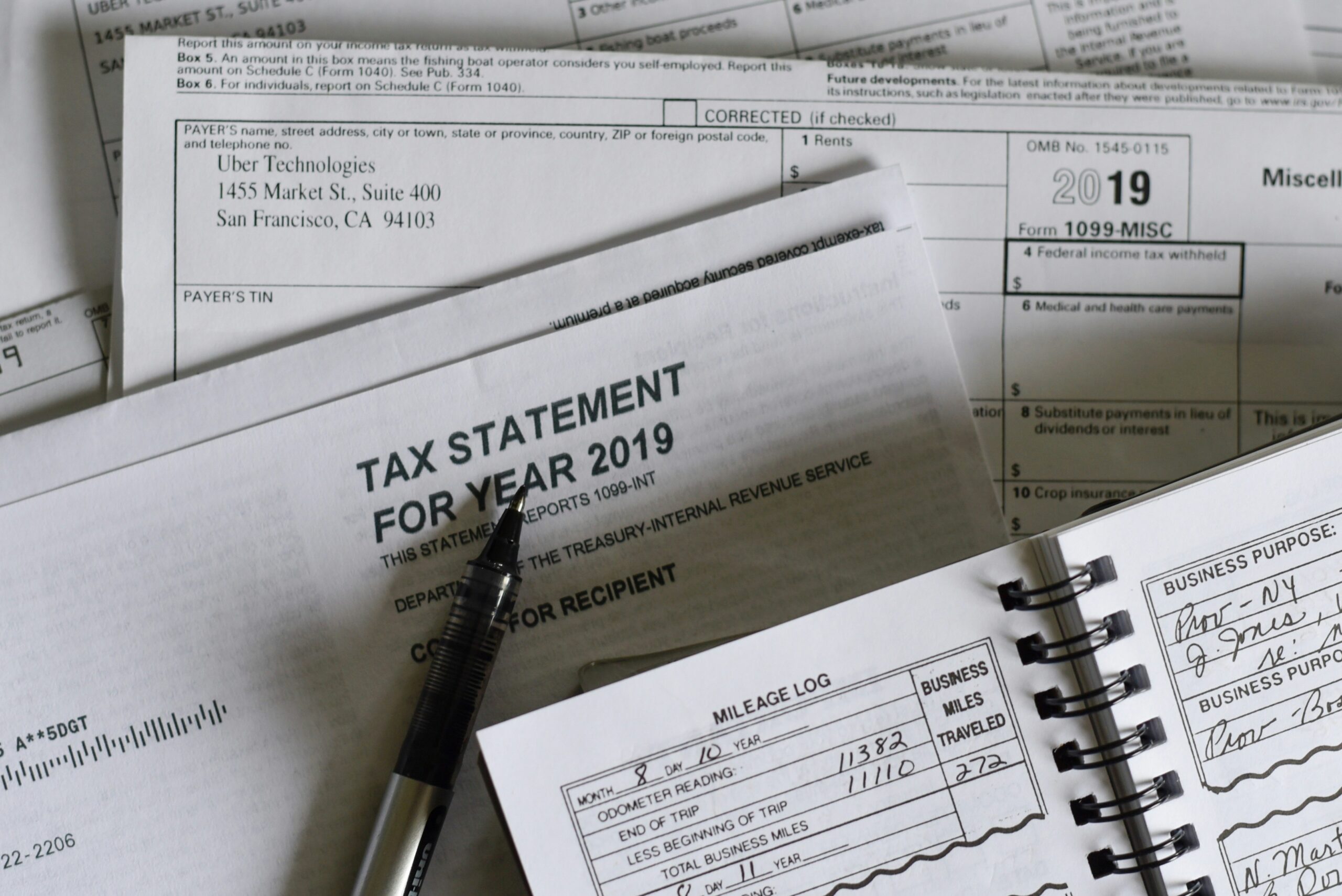 Tax forms and a calculator arranged on a desk, symbolizing tax preparation and financial planning. - Pinkham & Associates, APLC Tax forms and a calculator arranged on a desk, symbolizing tax preparation and financial planning.